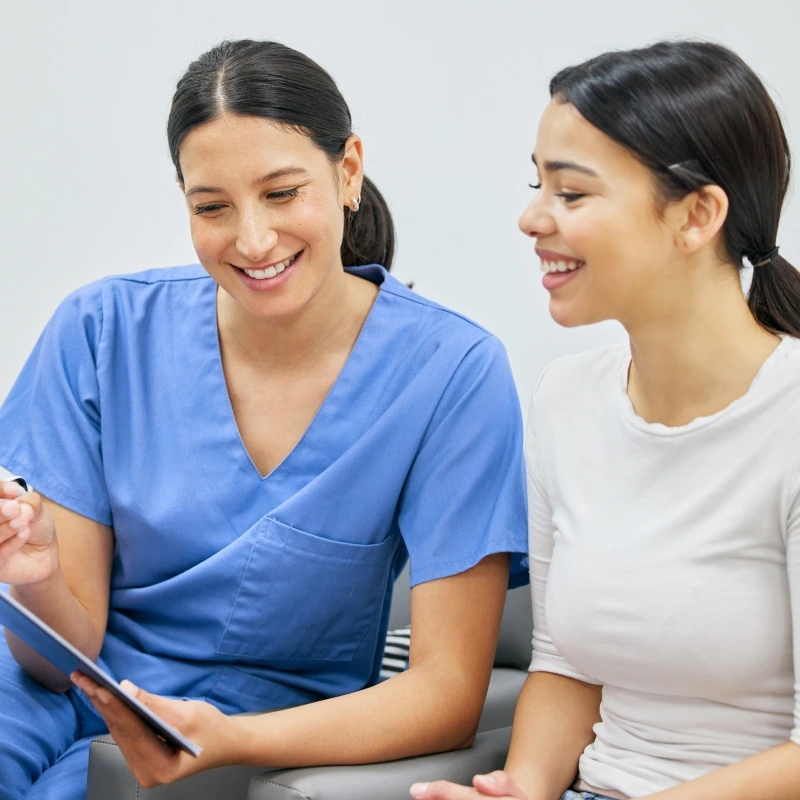 North Haven dentist reviewing dental insurance with a patient.